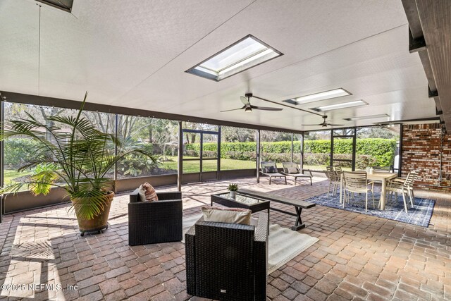 view of patio / terrace with a lanai, ceiling fan, and an outdoor hangout area