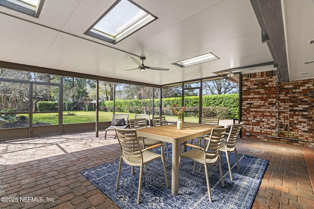 sunroom featuring ceiling fan