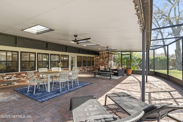 unfurnished sunroom featuring ceiling fan