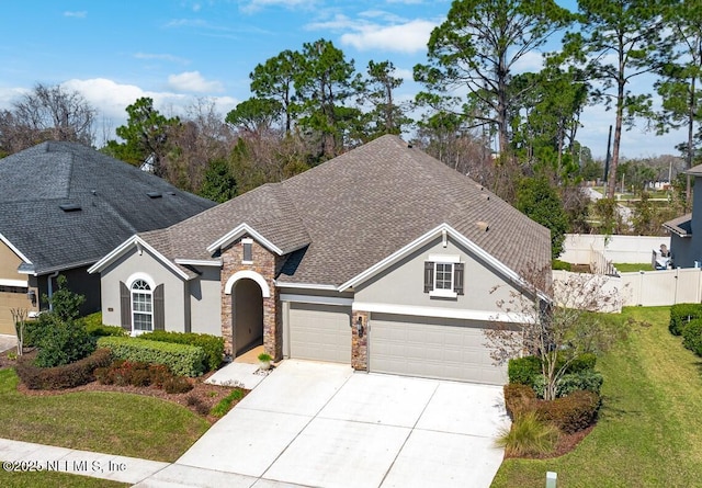 view of front of home with stone siding, roof with shingles, fence, and stucco siding