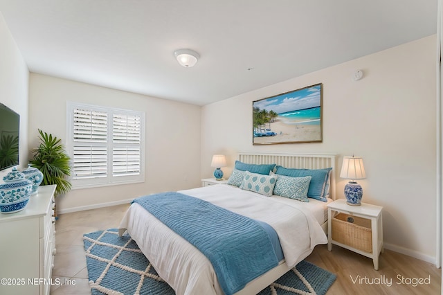 bedroom featuring baseboards