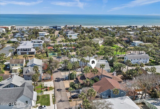 drone / aerial view featuring a residential view and a water view