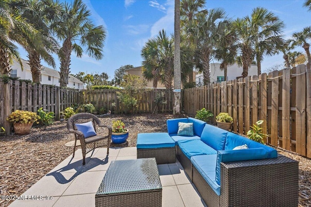 view of patio / terrace featuring a fenced backyard and an outdoor living space