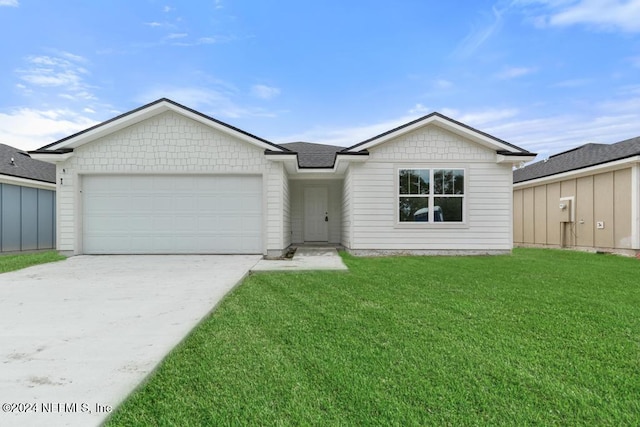 single story home with an attached garage, driveway, and a front yard