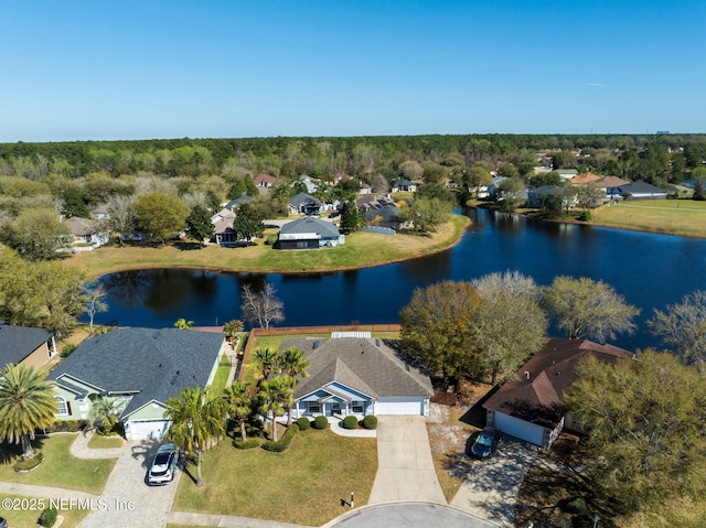 drone / aerial view featuring a water view and a residential view