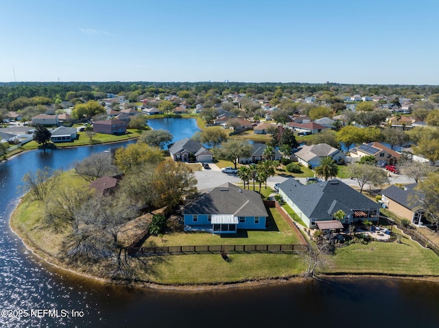 birds eye view of property with a residential view and a water view