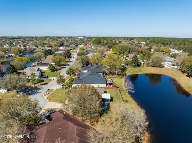 bird's eye view featuring a water view and a residential view