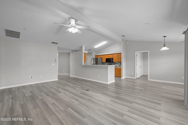 unfurnished living room with ceiling fan, vaulted ceiling with beams, visible vents, baseboards, and light wood-style floors