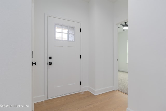 entrance foyer featuring light wood-style floors and baseboards