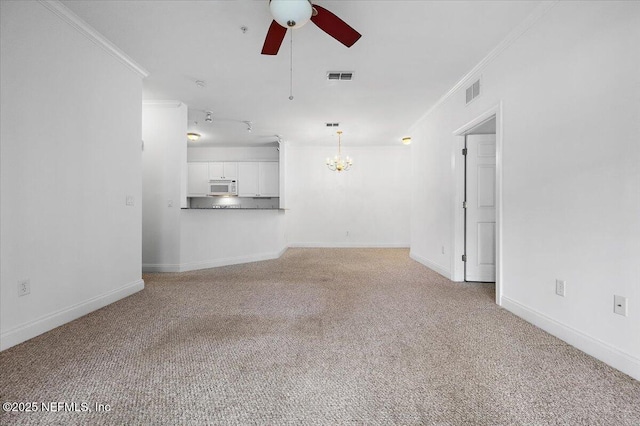 unfurnished living room with light colored carpet, visible vents, crown molding, and ceiling fan with notable chandelier