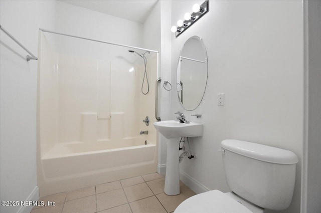 full bathroom featuring toilet, baseboards,  shower combination, and tile patterned floors