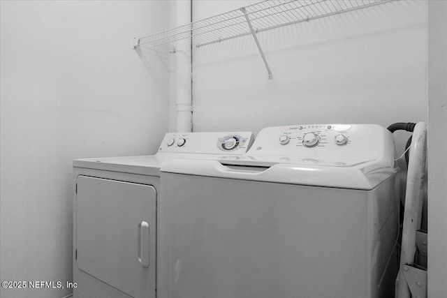 washroom featuring laundry area and independent washer and dryer