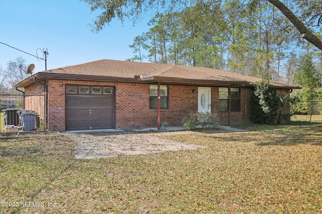 ranch-style home with central AC unit, a garage, brick siding, roof with shingles, and a front lawn