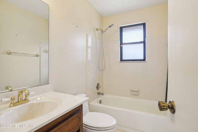 bathroom with vanity, shower / tub combination, and toilet