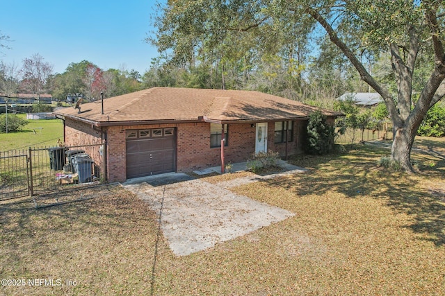 single story home featuring an attached garage, brick siding, fence, concrete driveway, and a front lawn