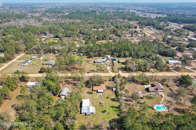 drone / aerial view with a view of trees