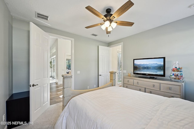 bedroom featuring a ceiling fan and visible vents