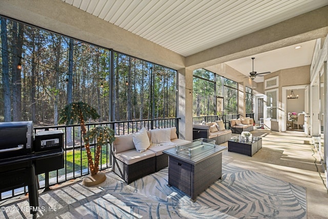 sunroom with a ceiling fan