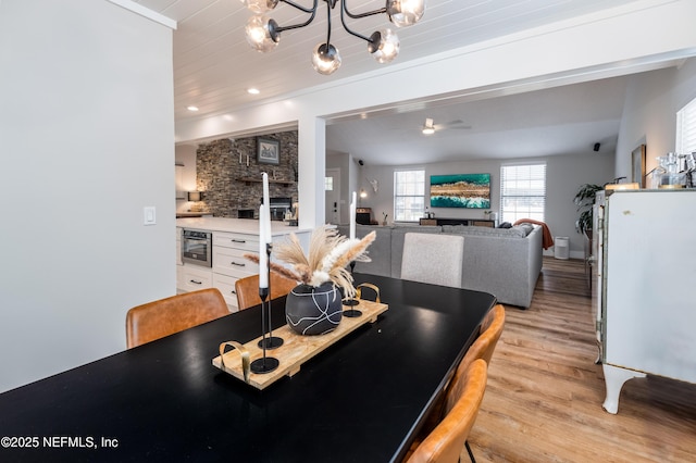 dining area with wooden ceiling, light wood finished floors, a notable chandelier, and recessed lighting