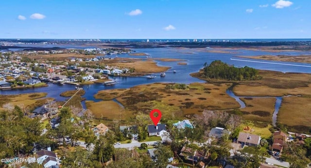 bird's eye view with a water view and a residential view