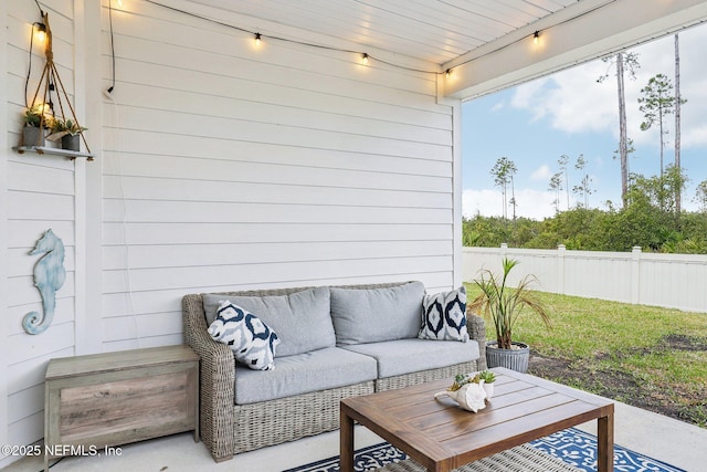 view of patio with fence and outdoor lounge area