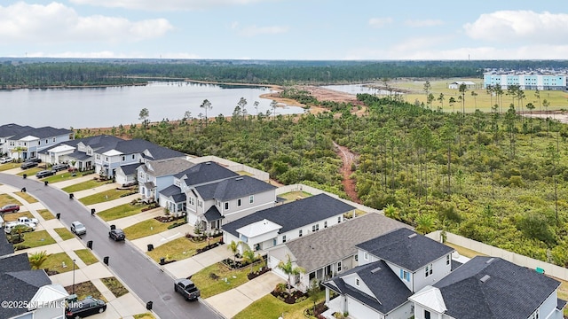 birds eye view of property featuring a water view and a residential view