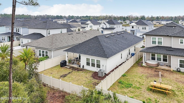 birds eye view of property with a residential view