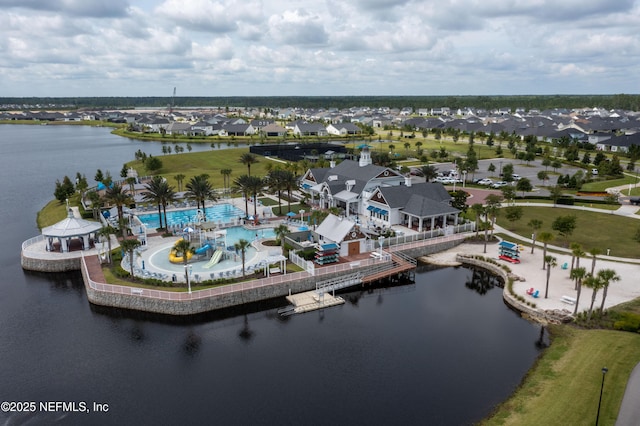 birds eye view of property with a water view and a residential view