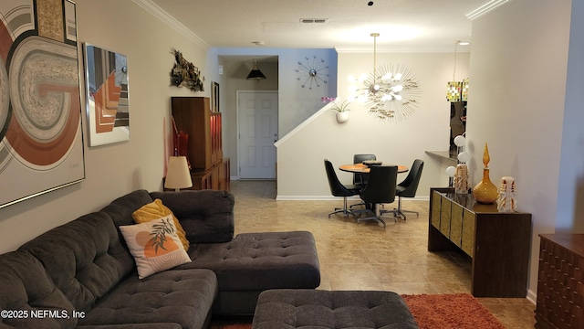 tiled living room featuring baseboards, visible vents, a notable chandelier, and ornamental molding