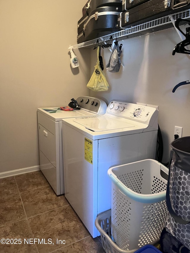 laundry area featuring laundry area, independent washer and dryer, and baseboards