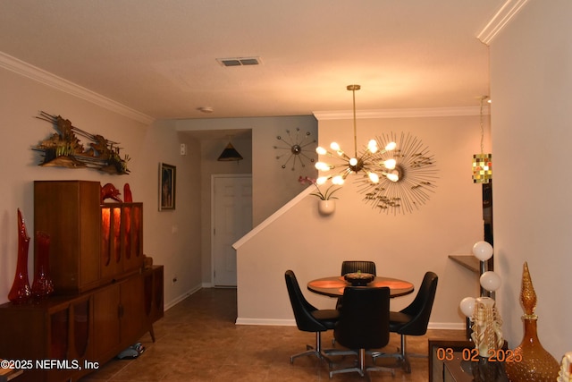 dining room featuring baseboards, ornamental molding, visible vents, and an inviting chandelier