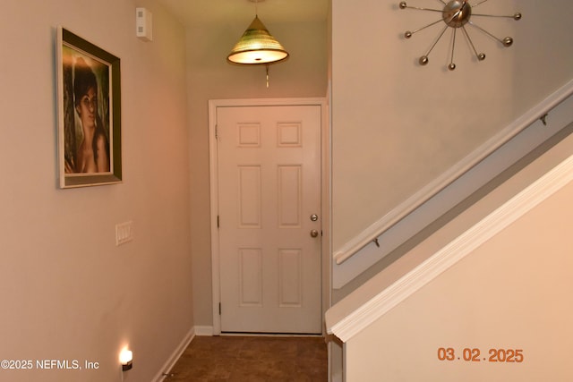 interior space featuring baseboards