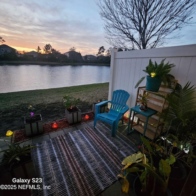 view of patio / terrace with a water view