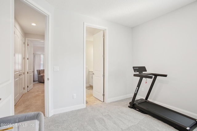 workout area featuring recessed lighting, carpet flooring, and baseboards