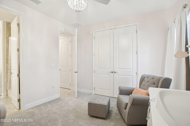 sitting room with light carpet and baseboards