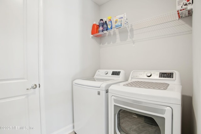 laundry room with washer and dryer and laundry area