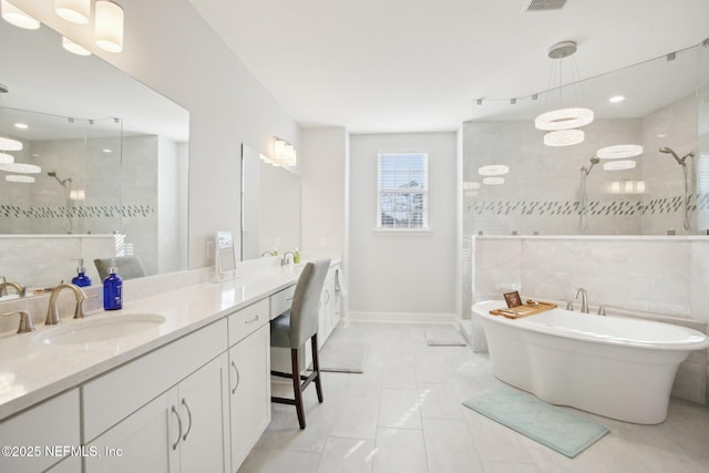 full bath featuring a soaking tub, visible vents, tiled shower, and vanity