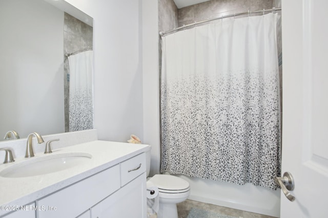 bathroom featuring shower / bath combo, vanity, and toilet