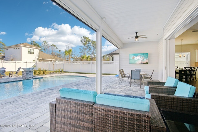 view of swimming pool with ceiling fan