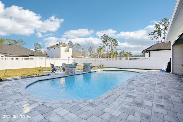 view of pool with a patio, a fenced backyard, and a fenced in pool