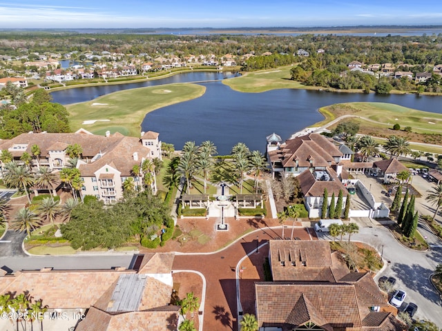 birds eye view of property with view of golf course, a water view, and a residential view