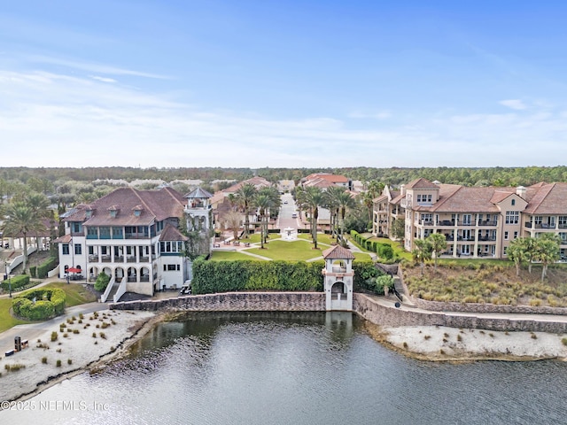 birds eye view of property with a residential view and a water view