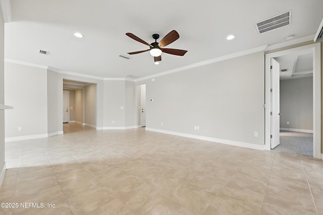 empty room with ornamental molding, visible vents, baseboards, and a ceiling fan