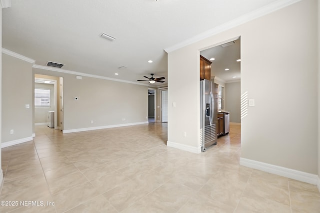 unfurnished room with ceiling fan, baseboards, visible vents, and crown molding