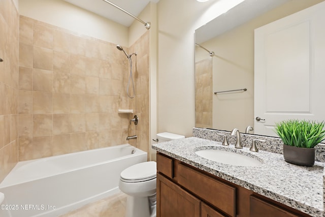 bathroom featuring toilet,  shower combination, and vanity