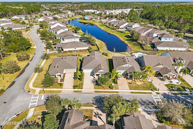 bird's eye view featuring a water view and a residential view