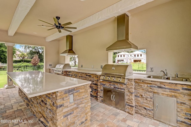 view of patio with a ceiling fan, a sink, area for grilling, and fence