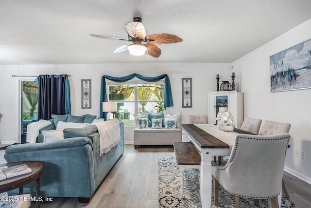 95170 Timberlake Dr, Fernandina Beach, FL 32034 - bedroom featuring light wood-style floors, ceiling fan, a textured ceiling, and baseboards