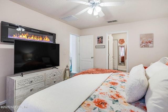 95170 Timberlake Dr, Fernandina Beach, FL 32034 - bedroom with a ceiling fan, visible vents, and ensuite bathroom