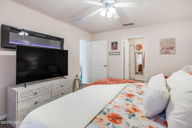 95170 Timberlake Dr, Fernandina Beach, FL 32034 - bedroom with visible vents, ceiling fan, and ensuite bath